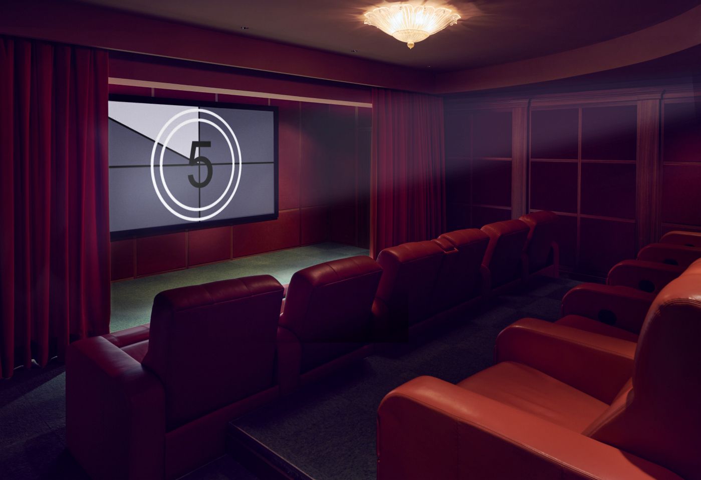 A private home cinema room with luxurious red leather seats, dark red drapes, and a classic ceiling light, ready for a screening with a countdown on the large screen.